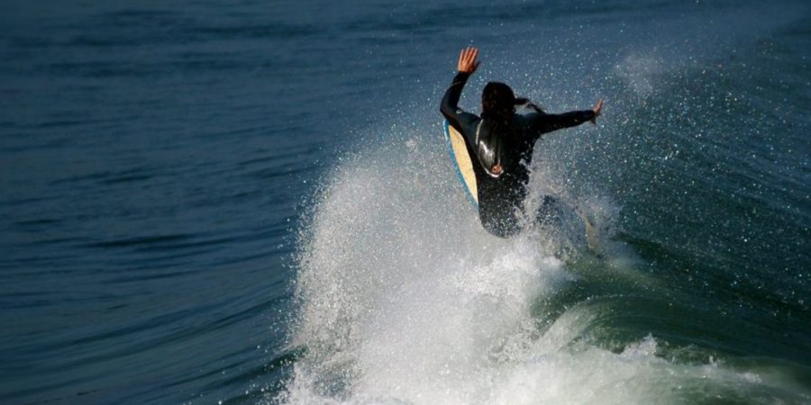 malibu surfer catching a wave