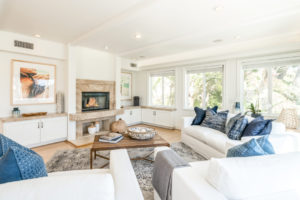 boho beach modern living room with fireplace at malibu home for sale